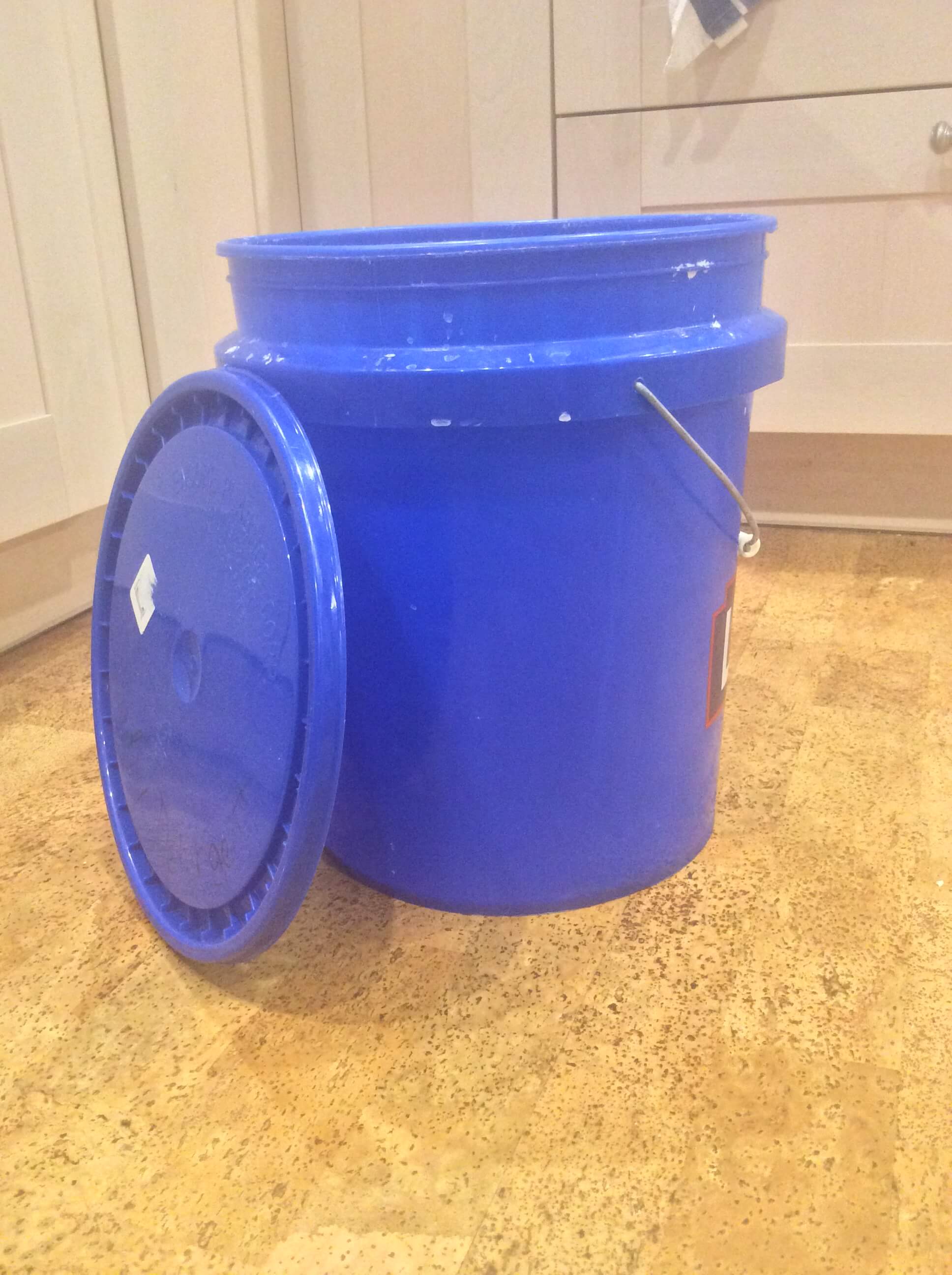 Fill the 5 gallon bucket up about halfway with hot water from the 
