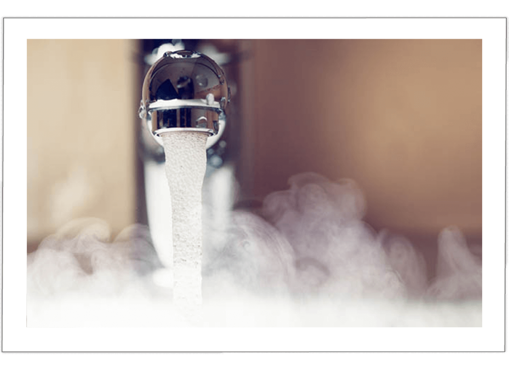 Image of faucet with steaming hot water
