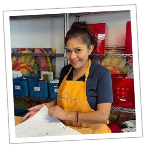 an image of a women employee of carpe diem smiling while checking his schedule about "customer care"